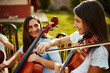 © StarDweller/peopleimages.com - Music, learning and violin with people in nature for talent, prodigy or orchestra performance. Art, creative and theater with teacher and child playing classical instruments in park for band practice