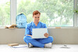 © Pixel-Shot - Male medical student studying with laptop at university