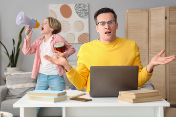 Sticker - Working young man stressed of his noisy little son at home