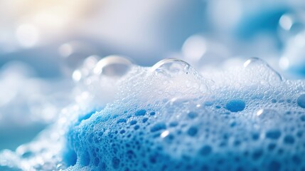 Isolated soap foam, bubbles, and blue sponge