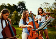 © StarDweller/peopleimages.com - Family, music and trio outdoor for talent, practice and rehearsal for event. Mother, children and classical performance in nature for learning, bonding and string instruments for skill development