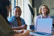© Sanc/peopleimages.com - Meeting, people and laptop screen in office for creativity, feedback and discussion for brainstorming. Workshop, tech and team at table for marketing strategy, company growth and planning for future