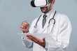 © InfiniteFlow - Doctor wearing virtual reality glasses while looking medical chart at white background. Professional doctor with lab coat using VR glasses while holding and pointing at application form. Deviation.