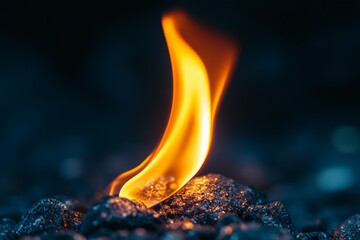 Aufkleber - A captivating close-up of a bright flame on a dark surface, highlighting the intense heat and glow of the fire, and the textural contrast between flame and background.