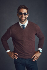 Poster - Employee, man and happy with sunglasses for fashion in studio on gray background as lawyer. Business person, proud and smile with confidence on career growth or opportunity with style and elegant