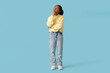 © Pixel-Shot - Thoughtful African-American girl on blue background