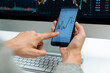 © InfiniteFlow - Smart stock investors pointing on screen with smartphone for market stock exchange along with laptop screen in highest dynamic investment rate, focusing data planning at modern workplace. Pecuniary.