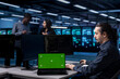 © DC Studio - Technician in server hub using green screen tablet to repair equipment storing datasets. IT specialist using mockup device to do debugging on rigs doing computational operations