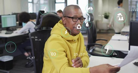 Sticker - Animation of data processing and ecology icons over diverse colleagues working in office