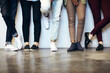 © FotoPush/peopleimages.com - Legs, waiting room and group of people for recruitment, hiring and work opportunity on wall background. Shoes, candidates and audition with onboarding for job interview, internship or human resources