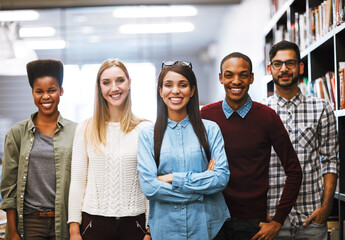 Portrait, happy group and students at university library for learning, education or knowledge. Face, smile and people together at college for diversity, team and confident friends with arms crossed