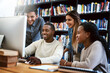 © BestCam/peopleimages.com - Students, computer and study in library for college, learning and education with exam collaboration. People, friends and diversity on university campus for research project, scholarship and IT course