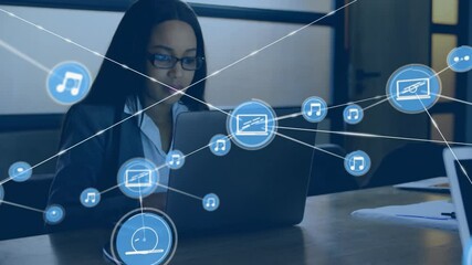 Poster - Animation of network of connections with icons over biracial businesswoman using laptop