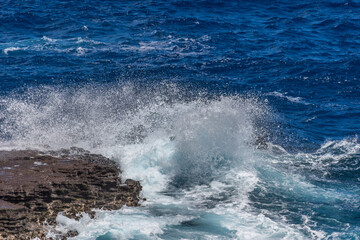 Dramatic Ocean crashing wave Hawaii at Makapu Point