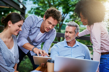 Aufkleber - Collaboration, feedback and technology with business people at restaurant for planning outdoor. Laptop, tablet and review with man and woman employee group at wooden table for teamwork together