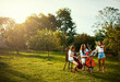 © StarDweller/peopleimages.com - Outdoor, group and women with violin, music and creativity with classical music, instrument and nature. People, forest and friends with event for earth day, team and environment with support and joy