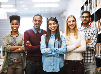 Poster - Portrait, happy team and students at college library for learning or education by bookshelf. Face, smile and group of people in university for diversity, unity or confident friends with arms crossed