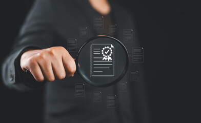 Aufkleber - Businessman holding a magnifying glass, showing Audit Document concept,quality assessment management With a checklist, business document evaluation process, market data report analysis and consulting