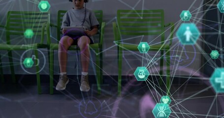 Poster - Animation of globe of connections with icons over caucasian boy patient with tablet
