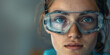 © theevening - Close up portrait of young woman wearing goggles with protective eye in the work.