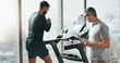 © peopleimages.com - Fitness, treadmill and man with personal trainer, gym and workout plan in document, training or exercise. Healthy, person and coach with checklist, sports and tracking of progress in club or wellness