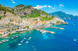 Amalfi on Amalfi Coast, Italy. Aerial photo of famous city Amalfi located on Amalfi Coast with blue sea water and beautiful colorful houses on the cliff