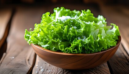 Wall Mural - Fresh and Crisp Green Lettuce in a Bowl on a Rustic Wooden Table with a Hint of Salt