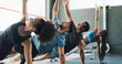 © peopleimages.com - Group, stretching and challenge with fitness, training and endurance for core, workout and practice. Diversity, healthy friends and men with women, exercise and energy in gym, support and balance