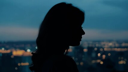 Poster - Profile Silhouette of a Woman with City Lights in the Background at Night

