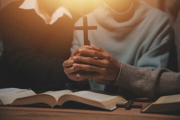 Wall Mural - Christian group are praying to god with the bible and sharing the gospel. Concept of faith for god.