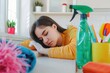 © alisaaa - Tired overworked housewife suffering from cleaning fatigue. Resting from household chores and housekeeping Tired overworked housewife suffering from cleaning fatigue. Resting from household chores and