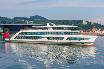 Cruise ship sailing on lake Lucerne with city background. Lucerne, Switzerland, 19 Aug 2022