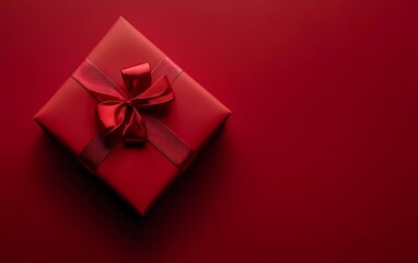 Top view of red gift box on red background for Christmas or Valentine's Day.