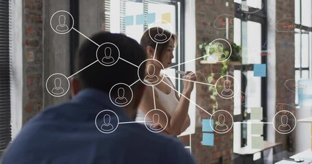 Canvas Print - Animation of network of connections with icons over diverse colleagues at meeting in office