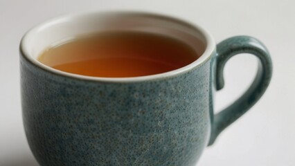 Wall Mural - homelike mug with tea on a white background