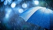 © antusher - Rainy day with blue umbrella and bokeh effect, close-up with dark background