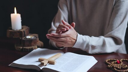 Wall Mural - Hand praying and praise with the holy bible in church. young man prayer confession sin for seeking peace relationship in Jesus christ. Christian pray and worship god with belief and spirituality.