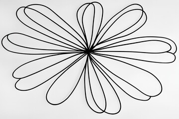 Poster - Abstract floral design featuring black loops arranged symmetrically on a white background. Ideal for modern decor themes.