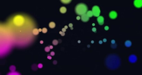 Poster - animation of glowing light spots moving over black background