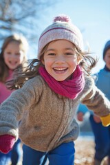 Wall Mural - A young girl is running with her friends and wearing a pink scarf. She is smiling and she is enjoying herself