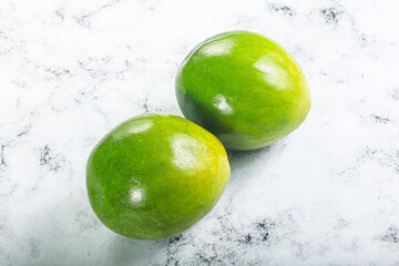 Wall Mural - Two ripe green exotic avocado fruit