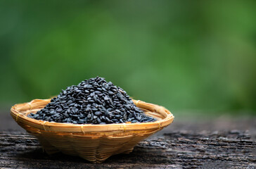 Black sesame seeds on natural background.