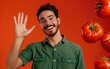 © JPGKING - A Spanish man with a friendly wave and a warm expression Isolated on Tomato Background, JPG Portrait image.