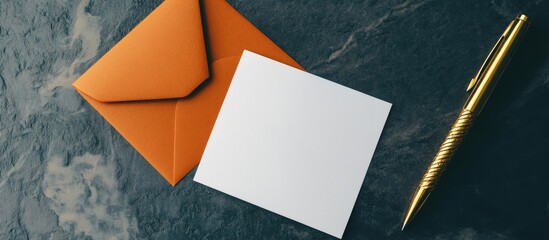 Poster - a blank white card beside a golden pen and an orange paper envelope. with copy space image. Place for adding text or design