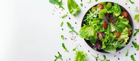 Poster - Fresh organic green salad presented on a plate against a white background featuring copy space for your text Top view of Vallerianella locusta corn salad or lamb lettuce Ideal template for a healthy