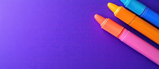 Poster - Open markers and text space on a purple background Pink blue and orange highlighters. with copy space image. Place for adding text or design