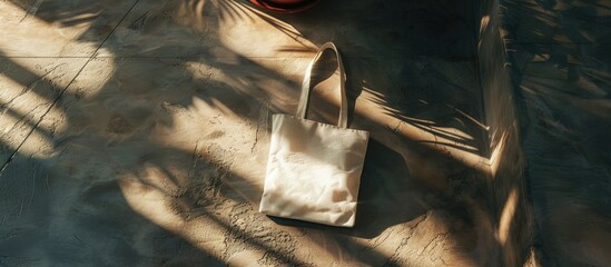 canvas tote bag on a stone surface with soft shadows. with copy space image. Place for adding text or design