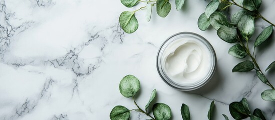 Aufkleber - Jar of moisturizing cosmetic cream for the face hands and body with eucalyptus leaves on a marble background Natural organic product Beauty and spa concept Body care Space for text Copy space
