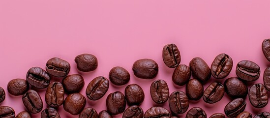 Aufkleber - Roasted and fragrant coffee beans on a pink colored surface as the background Top view with copy space for text Close up photo of fresh Arabica coffee beans