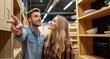 © Karina - A young couple explores modern kitchen cabinets in a stylish home showroom